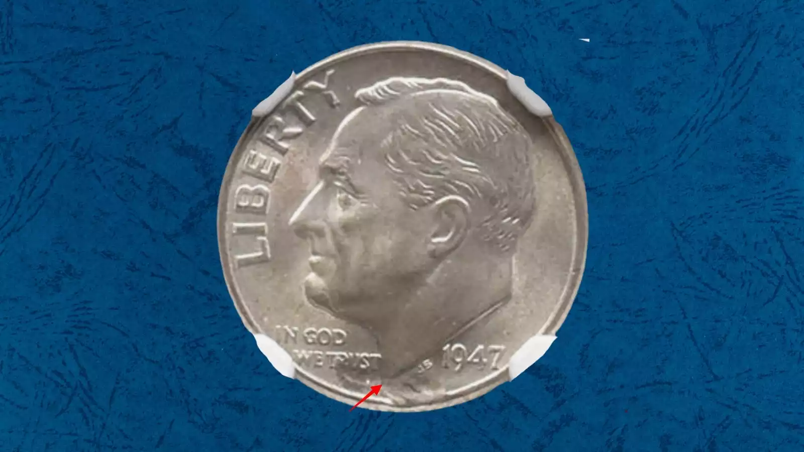 1947 Roosevelt dime struck-through error showing weak or missing design elements caused by debris between die and planchet